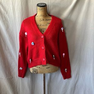 Red lollipop charmed knit sweater